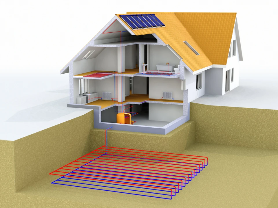 Installation géothermique dans le sol d'une maison : gros plan ou vue en coupe montrant les capteurs géothermiques enterrés dans le sol autour d'une maison, illustrant le concept d'extraction de chaleur du sous-sol. La photo doit montrer des tuyaux ou capteurs géothermiques rouges et bleus enterrés dans le sol avec la maison visible en arrière-plan, de jour, dans un environnement résidentiel français typique.